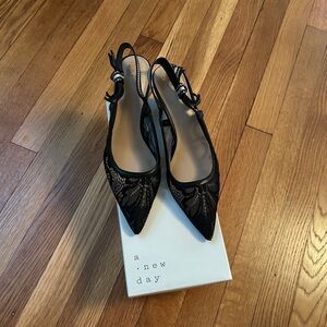 Black lace sling back pumps